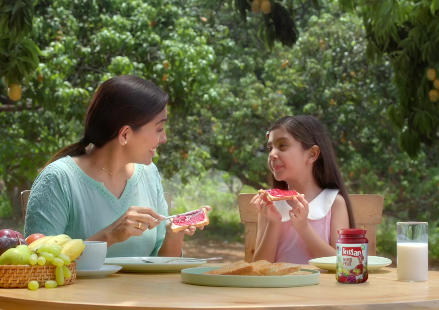 Mother and daughter at breakfast, Kissan · Jam