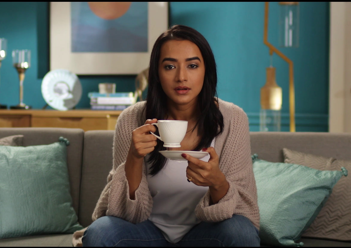 Woman with a teacup on a sofa, Duroflex · Energise II