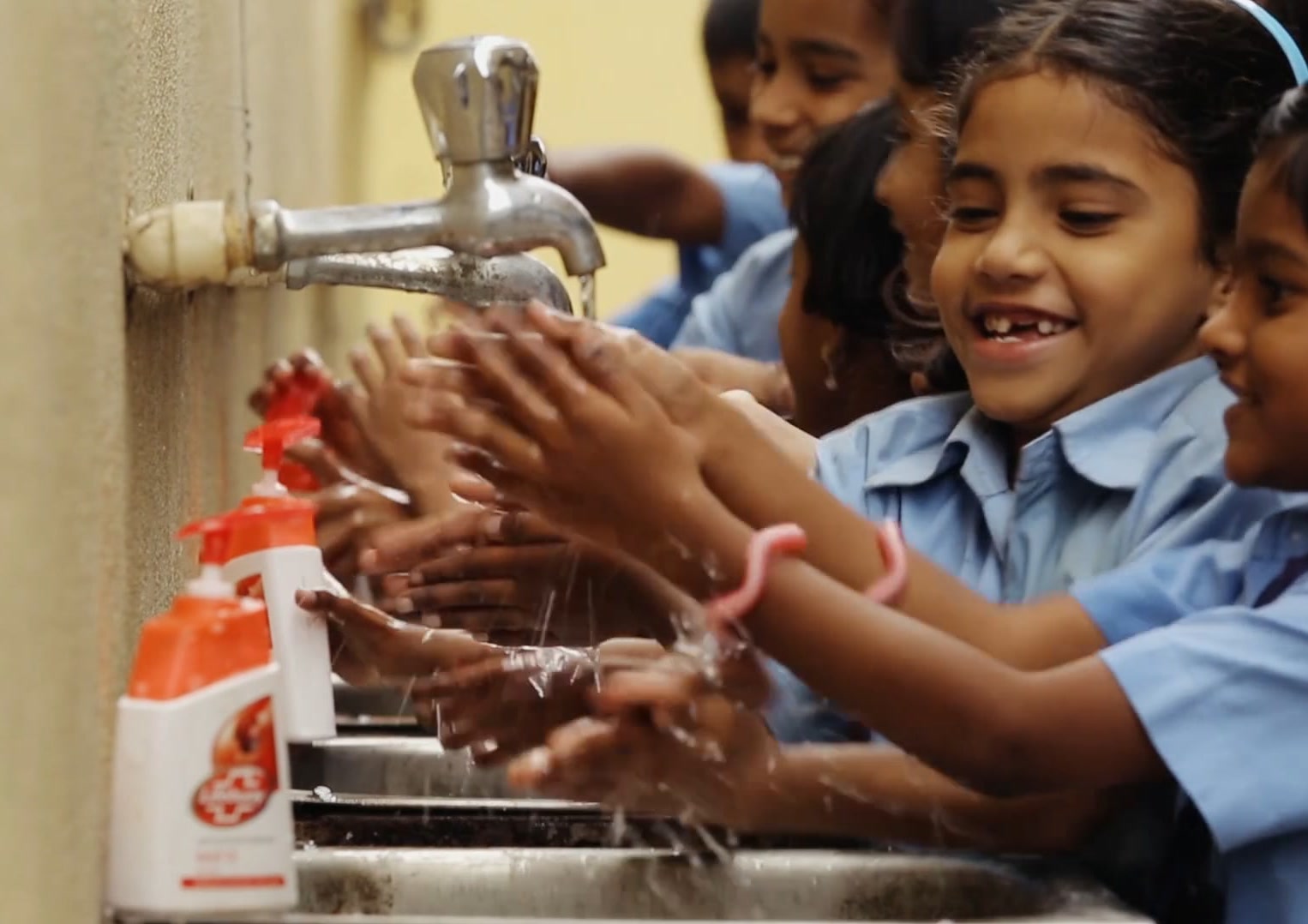 Schoolchildren washing hands with Lifebuoy soap, Lifebuoy · Lifesaver