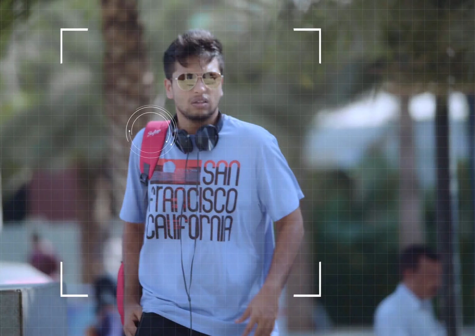 Man walking, seen through a viewfinder frame, Skybags